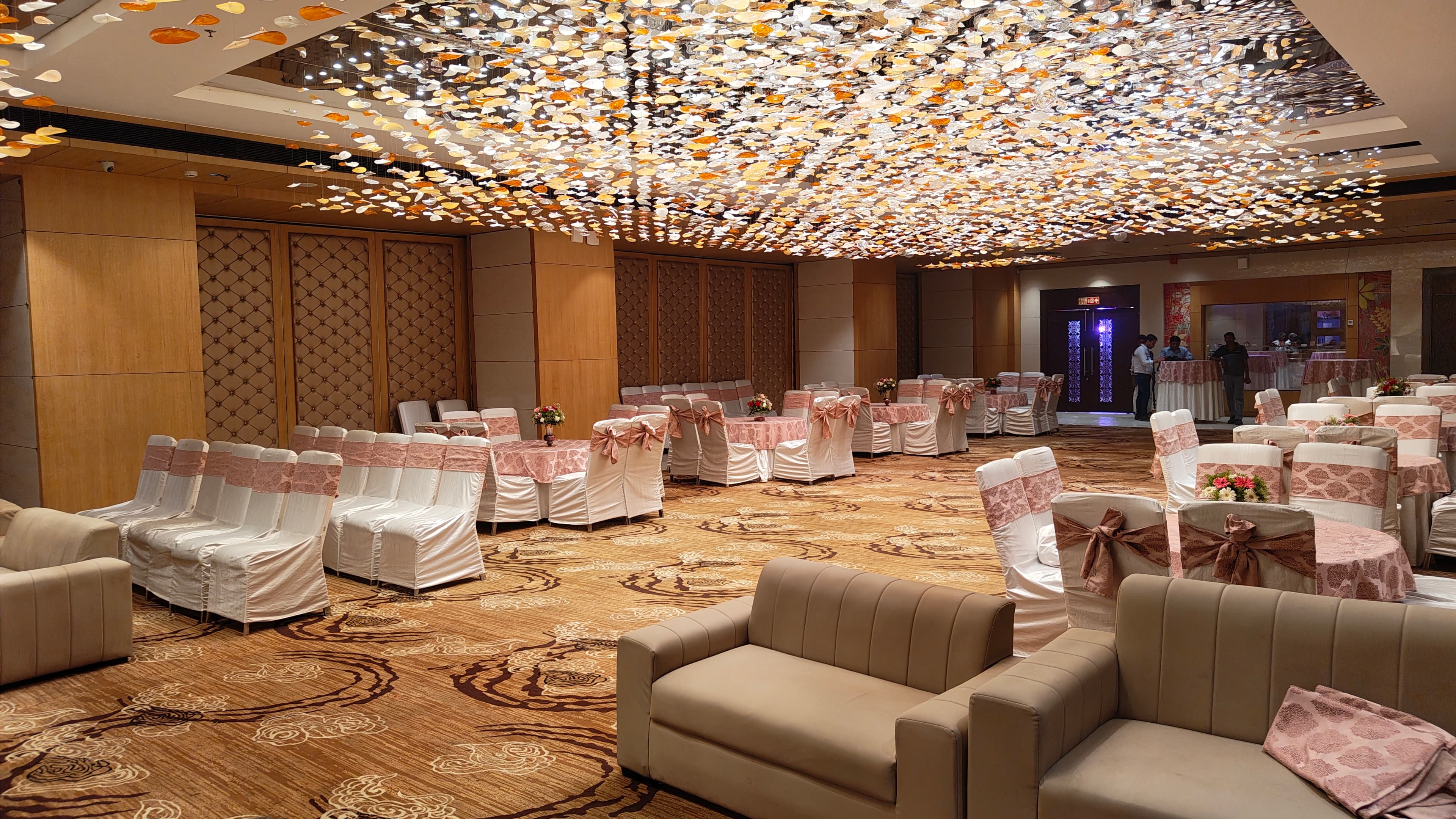Grand Ball Room lounge seating and round tables dressed for an evening event